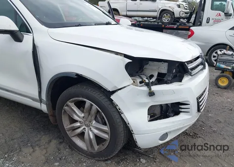 2014 Volkswagen Touareg Tdi Executive z USA, uszkodzony, nr VIN WVGEP9BP3ED009352